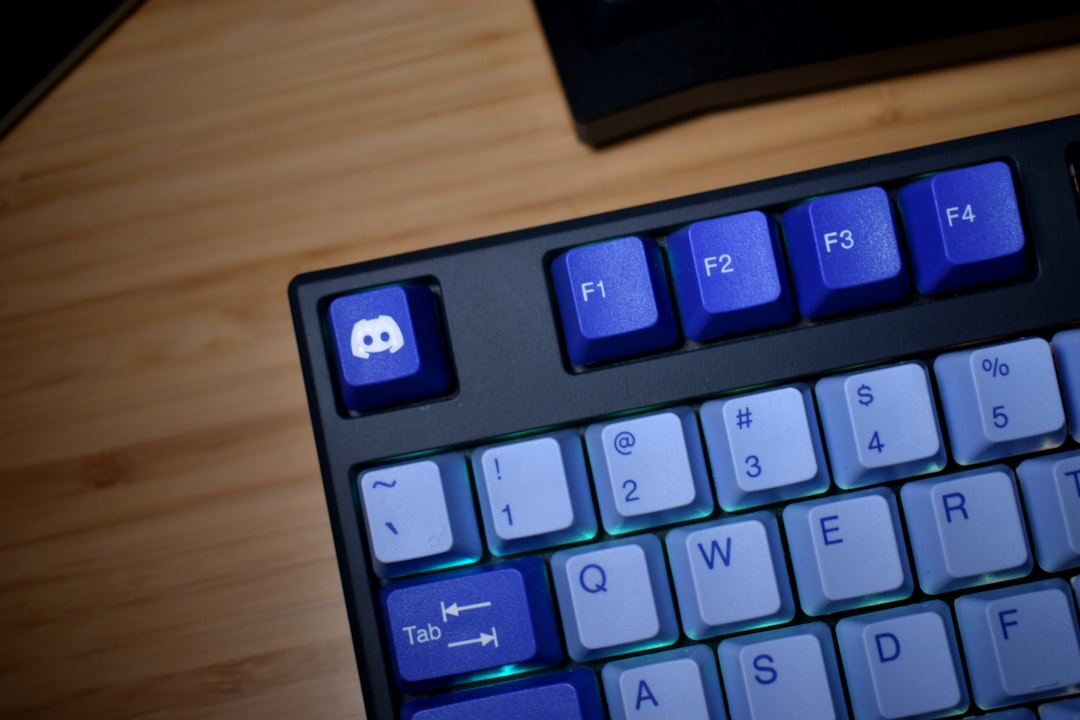 close-up-of-a-black-keyboard-with-blue-keys-rcsuwwkevu4